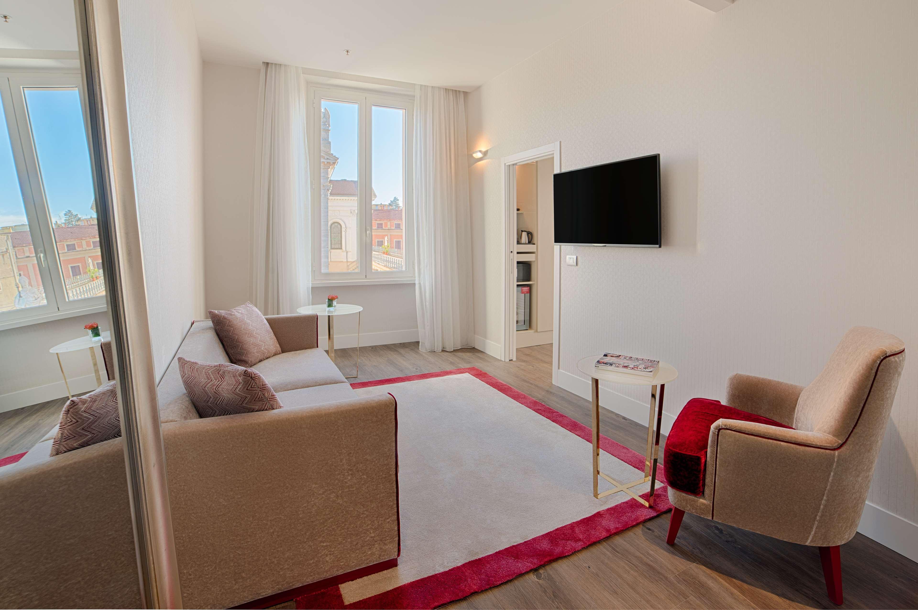 ホテル Nh コレクション パラッツォ チンクエチェント ローマ エクステリア 写真 A staged photo of a living room